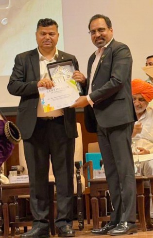 Dr SP Mohanty MD being felicitated by Honorable MoS Ministry of Jal Shakti Shri Raj Bhushan Choudhary